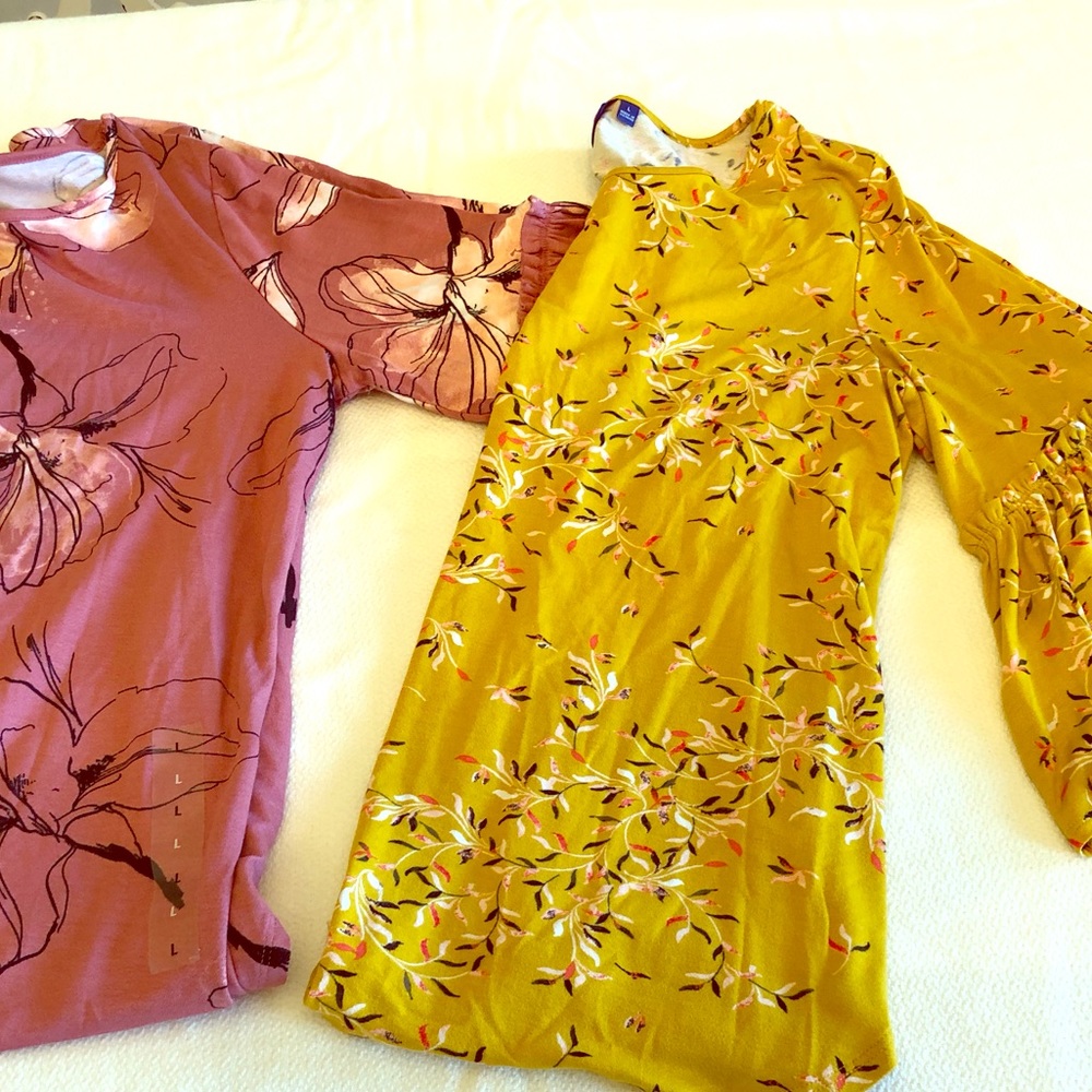Two dress shirts, one still has the sticker on it